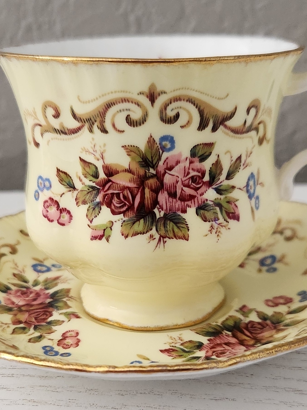 Paragon Antique Series Pale Yellow Vibrant Pink Rose Motif Tea Cup and Saucer
